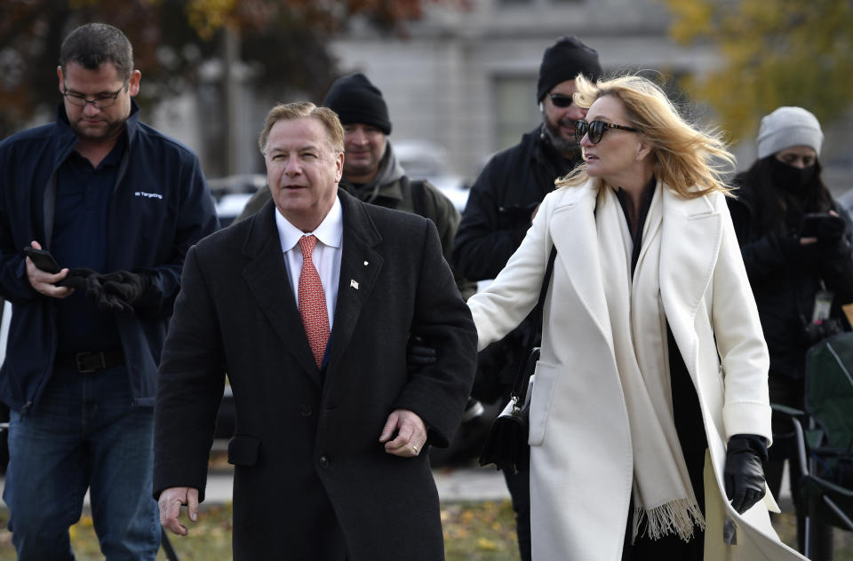 Mark McCloskey, center, and his wife, Patricia, make their way to the Kenosha County Courthouse during Kyle Rittenhouse's trial in Kenosha, Wis., on Tuesday, Nov. 16, 2021. (Sean Krajacic/The Kenosha News via AP)