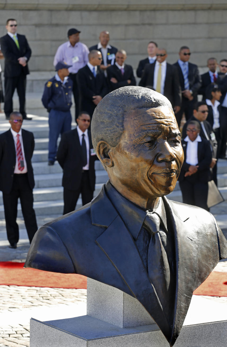 A bust of former South African President Nelson Mandela after it's unveiling by dignitaries at the South African Parliament in Cape Town, South Africa, Monday, April 28, 2014. South African President Jacob Zuma and members of the South African Parliament unveiled the bust of Mandela at Parliament, forming part of celebrations for 20-years anniversary of a democratic Parliament in South Africa after the end of white rule. (AP Photo/Schalk van Zuydam)