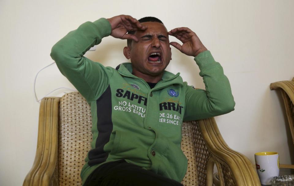 Gaza comedian Adel al-Mashwakhi sings the song that landed him in prison, during an interview with The Associated Press, in Gaza City, Thursday, Jan. 26, 2017. Gaza’s Hamas rulers have released al-Mashwakhi who was arrested two weeks ago for posting a Facebook video lamenting hardships under its rule. Adel al-Mashwakhi says he was released on bail on Wednesday on the condition that he does not make any more “politically flavored” works or discuss the conditions in which he was held. (AP Photo/Adel Hana)