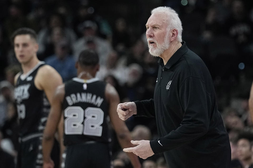San Antonio Spurs head coach Gregg Popovich talks to his players during the first half of an NBA basketball game against the Philadelphia 76ers in San Antonio, Friday, Feb. 3, 2023. (AP Photo/Eric Gay)