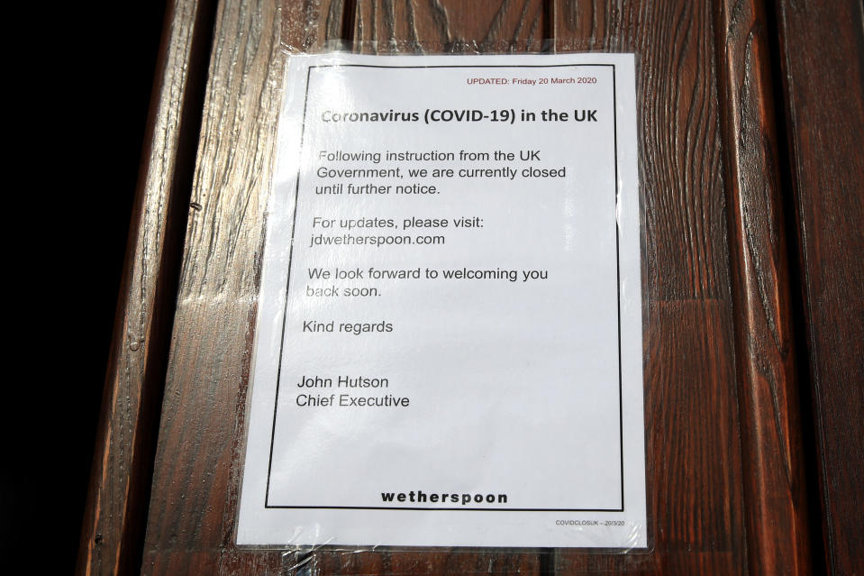 A Closed until further notice sign up in the front doors of The Samuel Hall Wetherspoons Pub in Sherwood, Nottingham. (Photo by Simon Cooper/PA Images via Getty Images)