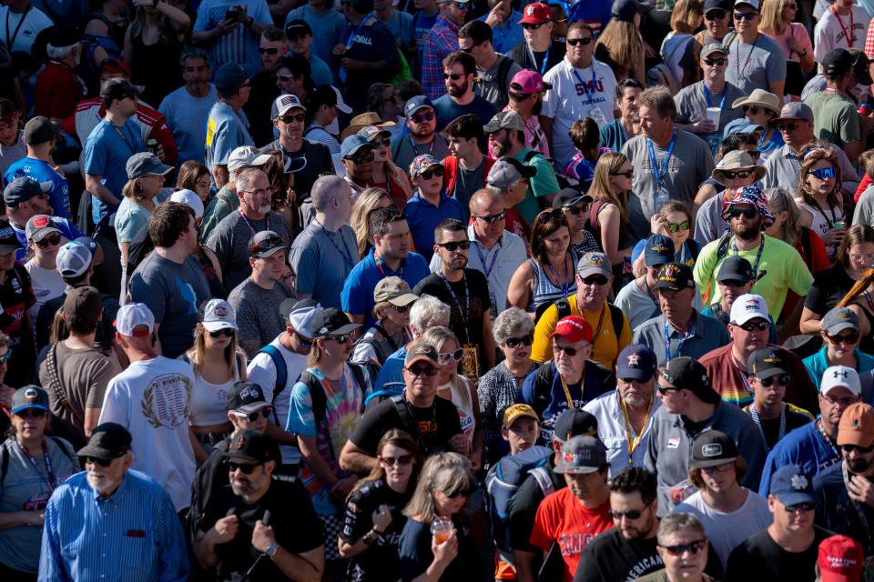 Fans move about Pagoda Plaza on Sunday, May 29, 2022, ahead of the 106th running of the Indianapolis 500 at Indianapolis Motor Speedway