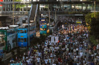 Demonstrators march in protest of the jailing of student leaders Joshua Wong, Nathan Law and Alex Chow, who were imprisoned for their participation of the 2014 pro-democracy Umbrella Movement, also known as "Occupy Central" protests, in Hong Kong China August 20, 2017. REUTERS/Tyrone Siu