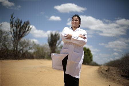 Cuban doctor Dania Rosa Alvero Pez poses for a photo in the street, near the health center where she works, in the city of Jiquitaia in the state of Bahia, north-eastern Brazil, November 18, 2013. REUTERS/Ueslei Marcelino