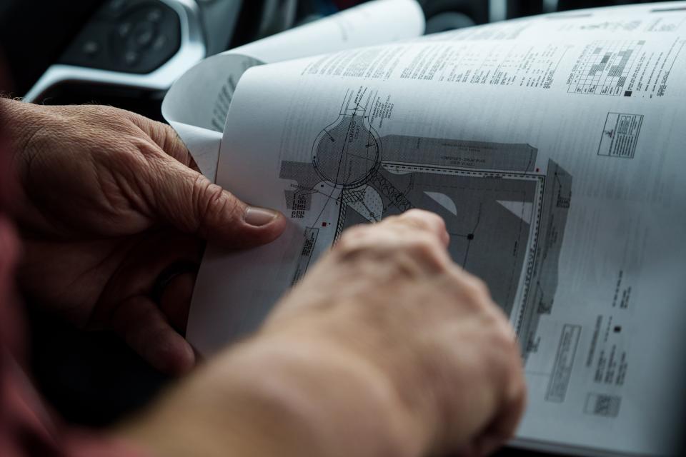 Eddie Hager, vice president of the Far Southeastern Neighborhood Association, points at a site plan for a truck parking lot on Elmwood Court in Beech Grove. He says the city has failed both in enforcing existing zoning laws and in putting in place new ordinances to hold the companies accountable.