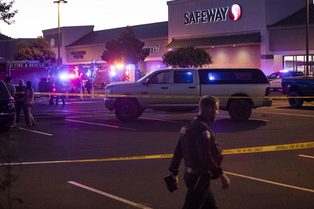 Emergency personnel respond to a shooting at the Forum shopping center in east Bend, Ore., on Aug. 28, 2022. (Ryan Brennecke/The Bulletin via AP, File)