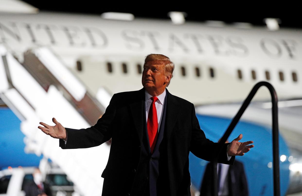 US President Donald Trump waves as he walks to board Marine One before departing for a campaign rally in Pennsylvania where he took a jab at Hillary Clinton. (Photo by NICHOLAS KAMM/AFP via Getty Images) (REUTERS)