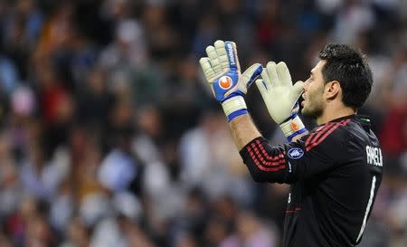 AC Milan's goalkeeper Marco Amelia reacts during their Champions League Group G soccer match against Real Madrid at Santiago Bernabeu stadium in Madrid October 19, 2010. REUTERS/Felix Ordonez