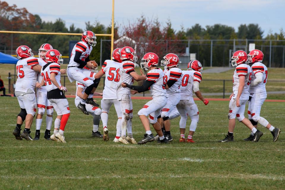 Old Rochester celebrates its Thanksgiving Day win over rival Lakers.