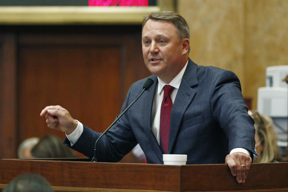 Speaker Pro-Tempore Jason White, R-West, calls upon lawmakers to consider the suspension of the rules and introduce a bill to take down the state flag, Saturday, June 27, 2020 at the Capitol in Jackson, Miss. The resolution passed as the chamber voted 85-34 for a resolution that now heads to the Senate, where it will also take a two-thirds vote to pass. The current flag has in the canton portion of the banner the design of the Civil War-era Confederate battle flag, that has been the center of a long-simmering debate about its removal or replacement. (AP Photo/Rogelio V. Solis)