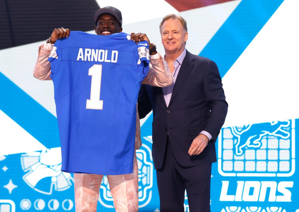 Terrion Arnold, a cornerback from the University of Alabama, shows off his Detroit Lions jersey with NFL commissioner Roger Goodell after he was picked in the first round of the 2024 NFL draft at the NFL draft theater in Detroit on Thursday, April 25, 2024.