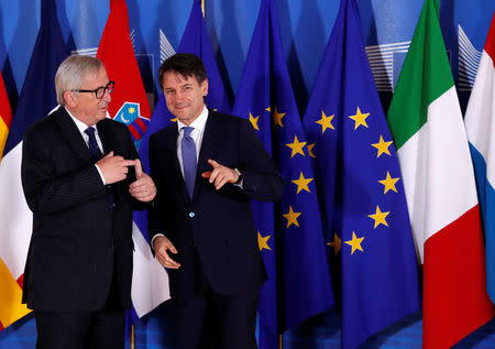 Italian Prime Minister Giuseppe Conte is welcomed by European Commission President Jean-Claude Juncker at the start of an emergency European Union leaders summit on immigration at the EU Commission headquarters in Brussels, Belgium June 24, 2018. REUTERS/Yves Herman/Pool