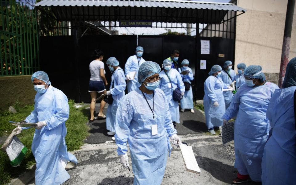 Health personnel visit residents during a health day in the municipality of Soyapango, El Salvador - Shutterstock