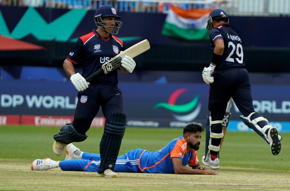 USA's Shadley Van Schalkwyk and Jessy Singh walk past India's Mohd Siraj during the ICC men's Twenty20 World Cup 2024 group A cricket match between the USA and India at Nassau County International Cricket Stadium in East Meadow, New York on June 12, 2024.