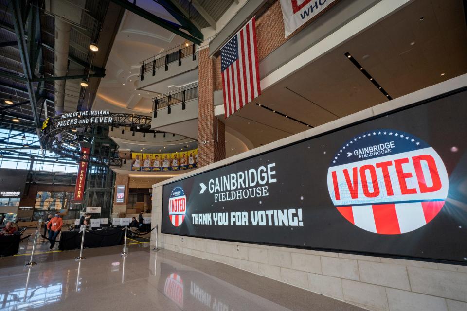 A giant digital wall makes for a great selfie wall, said workers, Tuesday, Nov. 8, 2022 at the Gainbridge Fieldhouse voting site in Indianapolis, Ind.