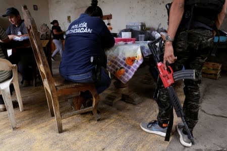 Vigilantes are seen at the command headquarters in the municipality of Coahuayana