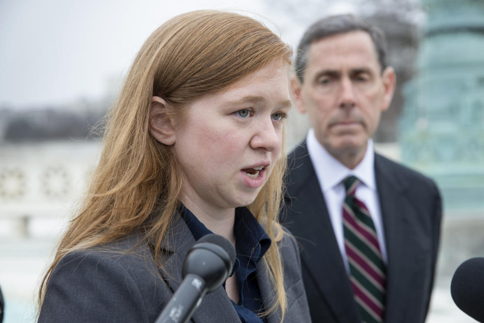 FILE - Abigail Fisher, who challenged the use of race in college admissions, joined by lawyer Edward Blum, right, speaks to reporters outside the Supreme Court in Washington, Dec. 9, 2015. Fisher, who is white, sued after being rejected in 2008 from the University of Texas at Austin. She argued the university's policy discriminated against her because of race, in violation of the Constitution. (AP Photo/J. Scott Applewhite, File)