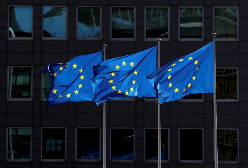 FILE PHOTO: European Union flags flutter outside the European Commission headquarters in Brussels, Belgium