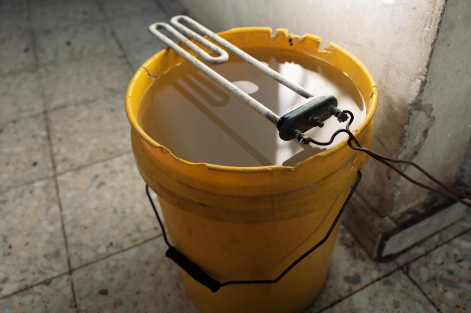 The heating element resting on a bucket of water (Paddy Dowling)