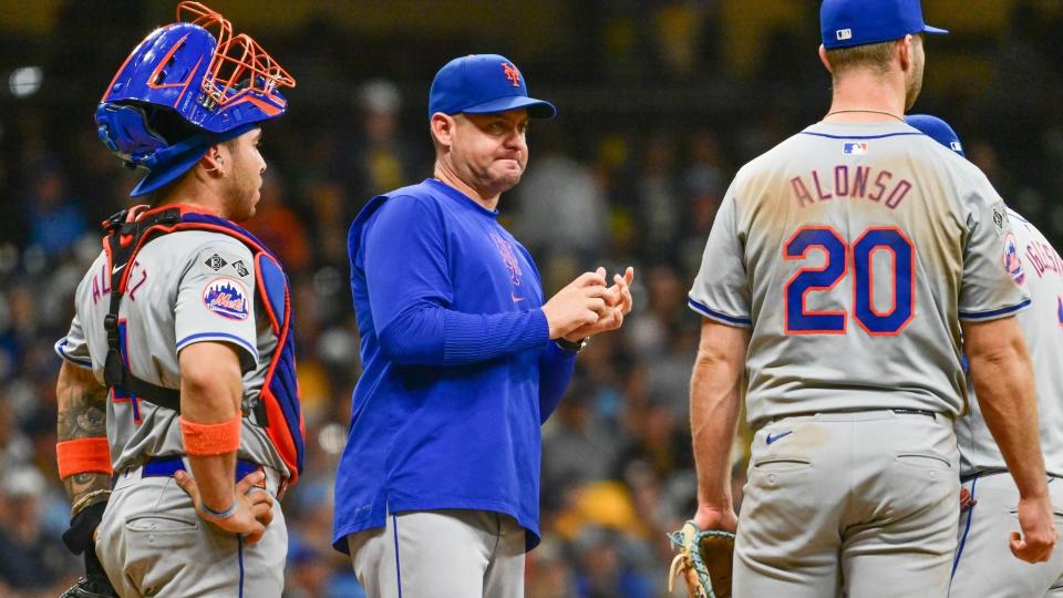 Sep 28, 2024; Milwaukee, Wisconsin, USA; New York Mets manager Carlos Mendoza makes a pitching change in the eighth inning against the Milwaukee Brewers at American Family Field. 