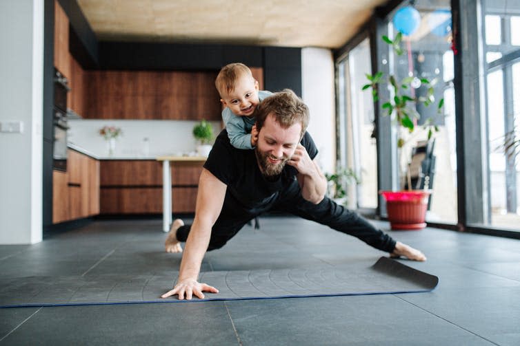 <span class="caption">Kids… also useful as weights.</span> <span class="attribution"><a class="link " href="https://www.shutterstock.com/image-photo/father-working-out-doing-single-arm-1669031986" rel="nofollow noopener" target="_blank" data-ylk="slk:Kuznetsov Dmitriy/Shutterstock;elm:context_link;itc:0;sec:content-canvas">Kuznetsov Dmitriy/Shutterstock</a></span>