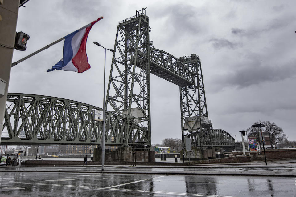 The iconic historic De Hef - Koningshavenbrug Bridge in the Dutch port city of Rotterdam may be dismantled for Jeff Bezos superyacht to pass under, as the mast of the sailboat exceeds the height of the bridge. The two-tower with swing lift bridge is an old level steel railroad bridge connecting the island, Noordereiland in the Maas river in the Southern part of Rotterdam. The bridge was built in 1877 and suffered damage during the 1940 German bombings. Since 2017 after the renovation work, the municipality promised that the bridge would never be dismantled again. The superyacht for the multibillionaire chairman of Amazon is built in the Dutch shipyards of Oceanco. The city council said in a statement that if they will proceed the cost of the deconstruction will be covered by the shipbuilder. Rotterdam, The Netherlands on February 4, 2022 (Photo by Nicolas Economou/NurPhoto via Getty Images)