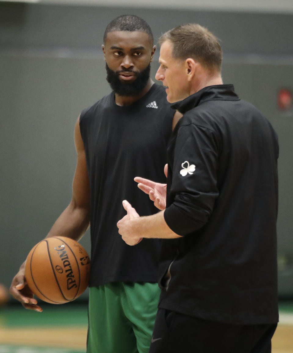 Boston Celtics' Jaylen Brown, left, listens to assistant coach Jay Larranaga during the NBA basketball team's training camp, Tuesday, Oct. 1, 2019, in Boston. (AP Photo/Elise Amendola)