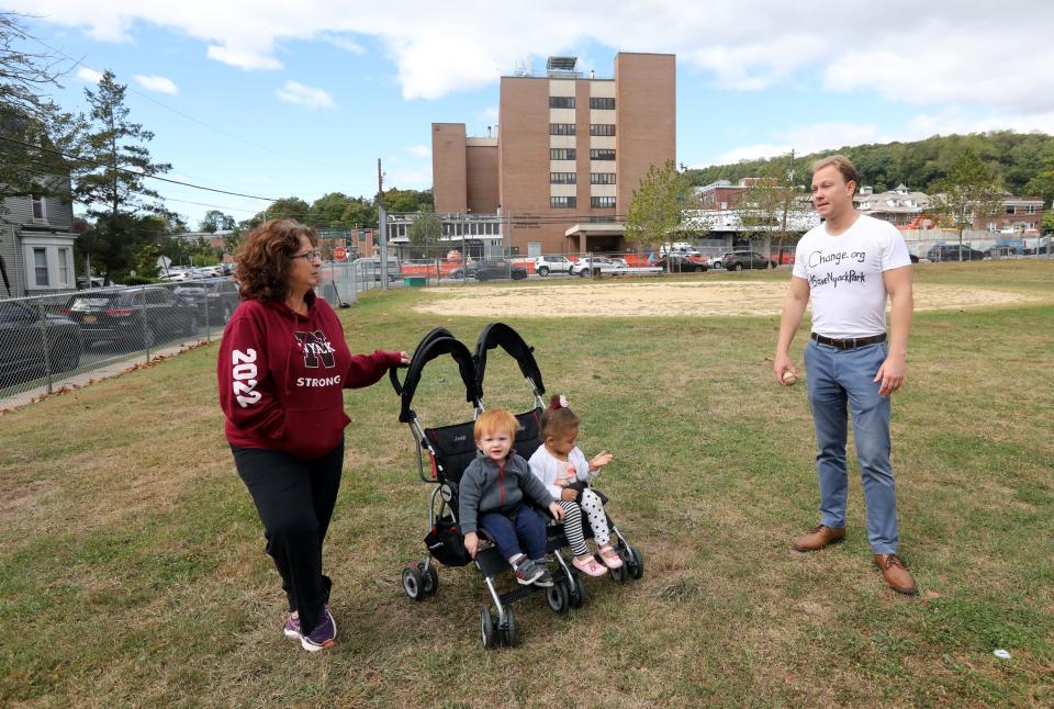Nyack resident Justin Machia chats with his neighbor Tina Guarasci, who runs a daycare on Haven Court, at MacCalman Field in Nyack Oct. 4, 2019. They are trying to save the park, which is used by several community groups, from being turned into a parking lot by Montefiore Nyack Hospital.