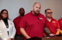 United Auto Workers (UAW) National Bargaining Committee Chair Ted Krumm addresses the media about the general strike against General Motors in Detroit,