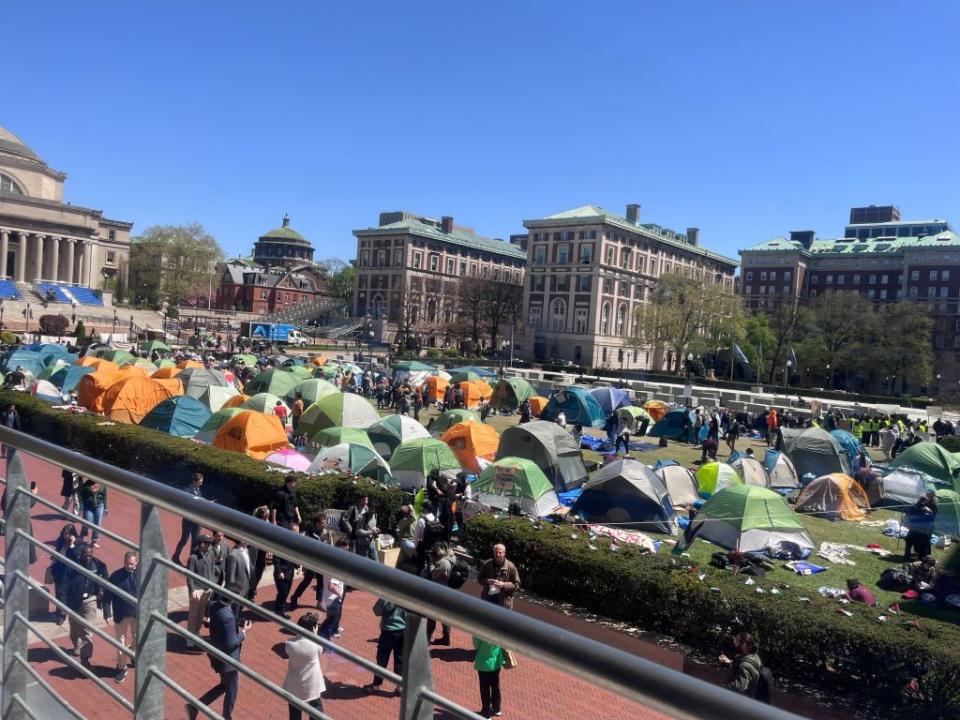 Tents are lined up across the lawn at Columbia as students dig in under sunny skies.