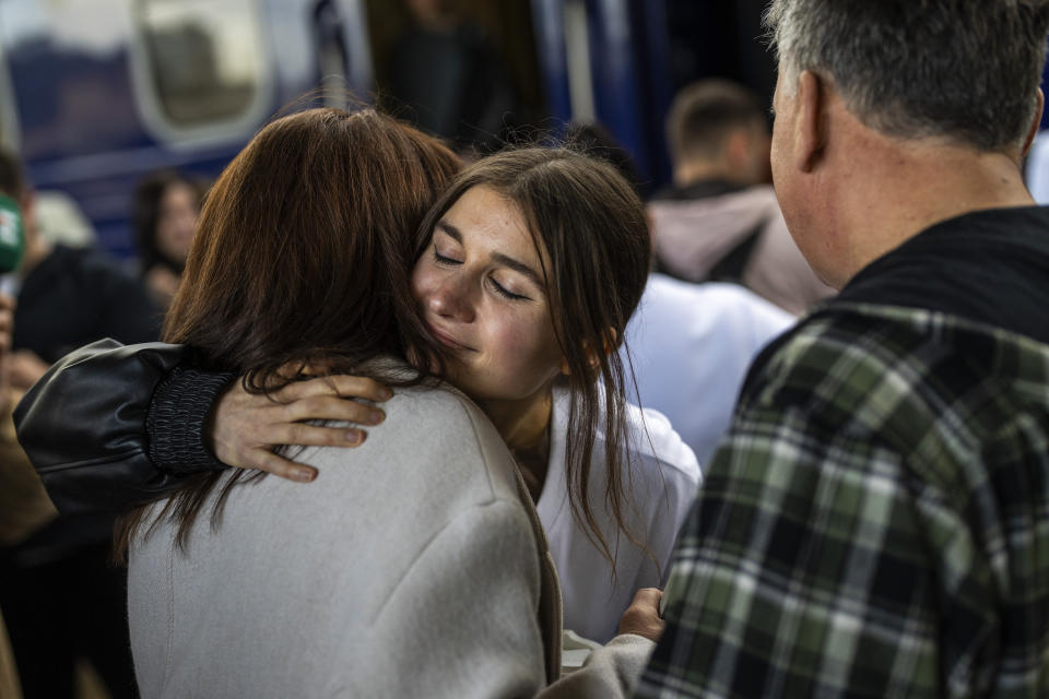 Ukrainian singer Jerry Heil says goodbye to her parents before departing at the main train station, in Kyiv, Ukraine, Thursday, April 25, 2024. Ukraine’s entrants in the pan-continental music competition, the female duo of rapper alyona alyona and singer Jerry Heil set off from Kyiv for the competition on Thursday. In wartime, that means a long train journey to Poland, from where they will travel on to next month’s competition in Malmö, Sweden. (AP Photo/Francisco Seco)