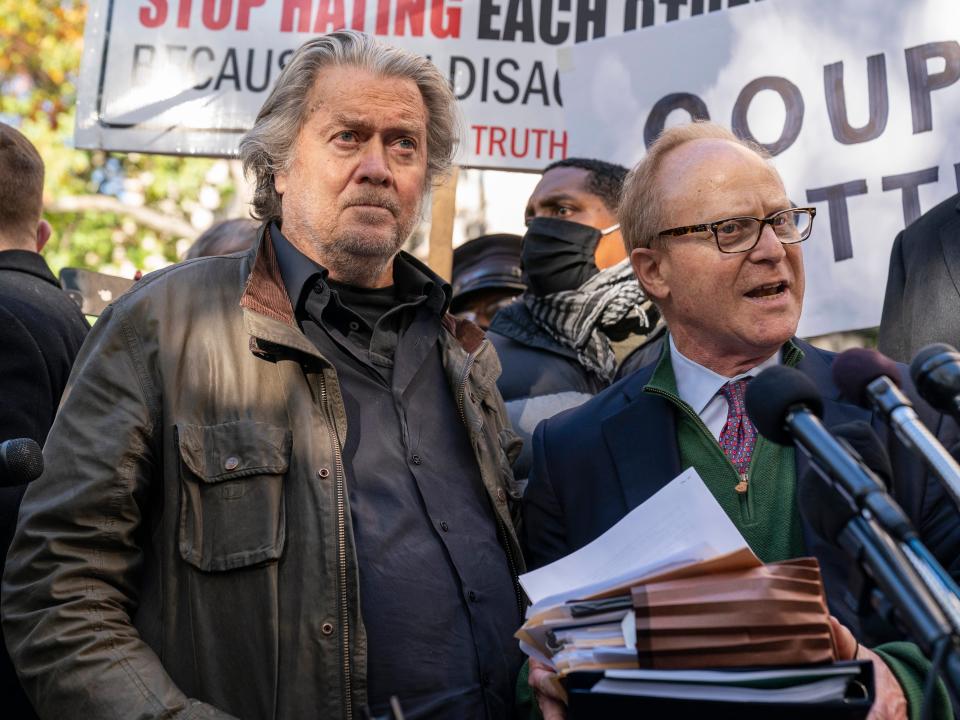 Former White House strategist Steve Bannon, center, and attorney David Schoen, right, pause to speak with reporters after departing federal court, Monday, Nov. 15, 2021, in Washington