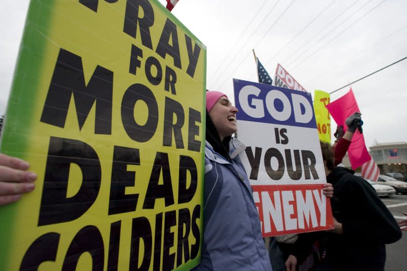 Members of the Westboro Baptist Church protest the funeral of Sgt. 1st Class Johnny Walls in Port Orchard, Wash., on November 30, 2007. On Aug. 6, 2012, U.S. President Barack Obama signed legislation that bans protests within 300 feet of military funerals 2 hours before or after the services. File Photo by Jim Bryant/UPI