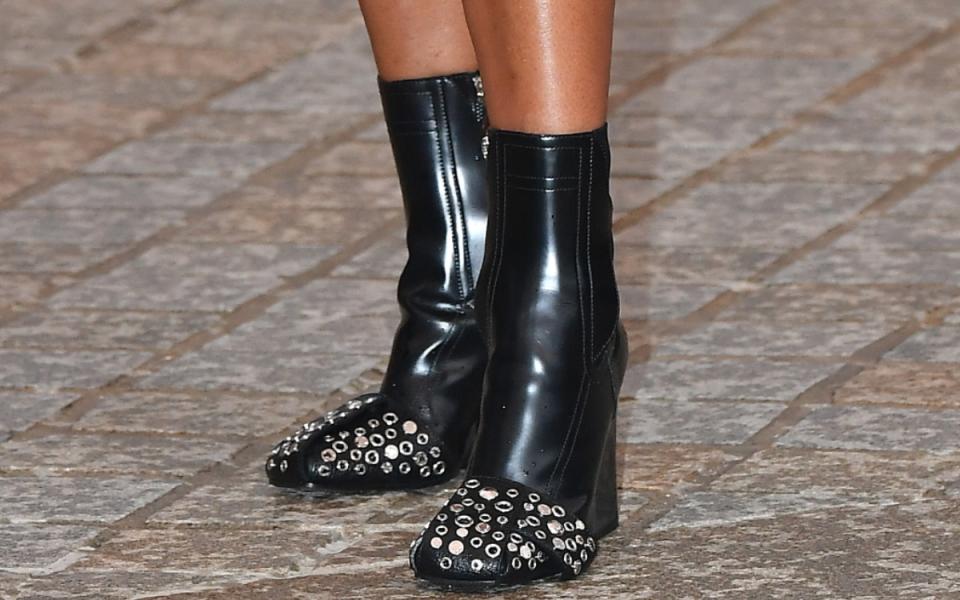 regina king, regina king shoe style, shoes, boots, black leather embellished ankle boots, ankle boots, wedge ankle boots, wedge heel ankle boots