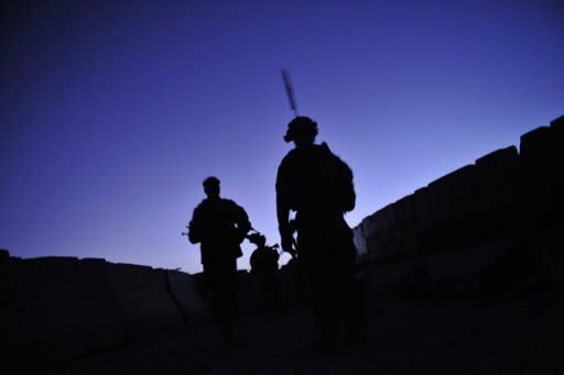 US and Afghan troops conduct a joint security patrol in southern Afghanistan. Afghanistan and the United States signed a deal on special forces operations in the insurgency-wracked country Sunday putting Afghans in charge of controversial night raids