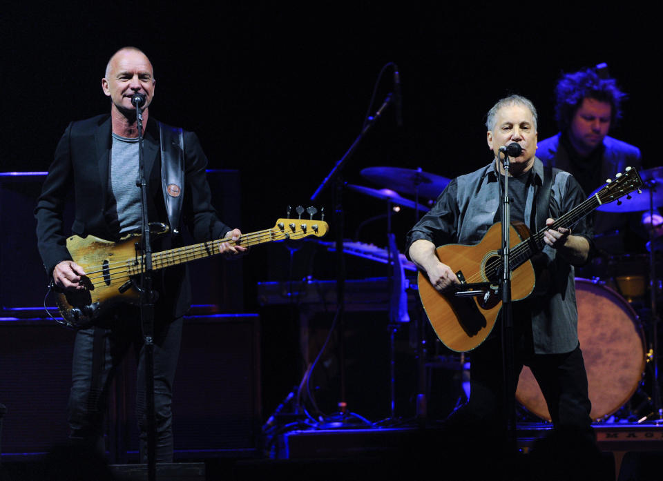 Musicians Sting, left, and Paul Simon perform together in concert at Madison Square Garden on Tuesday, March 4, 2014, in New York. (Photo by Evan Agostini/Invision/AP)