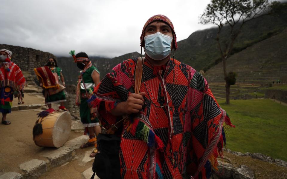 People prepare to attend the official act of reopening Machu Picchu - Paolo Aguilar/EPA-EFE/Shutterstock