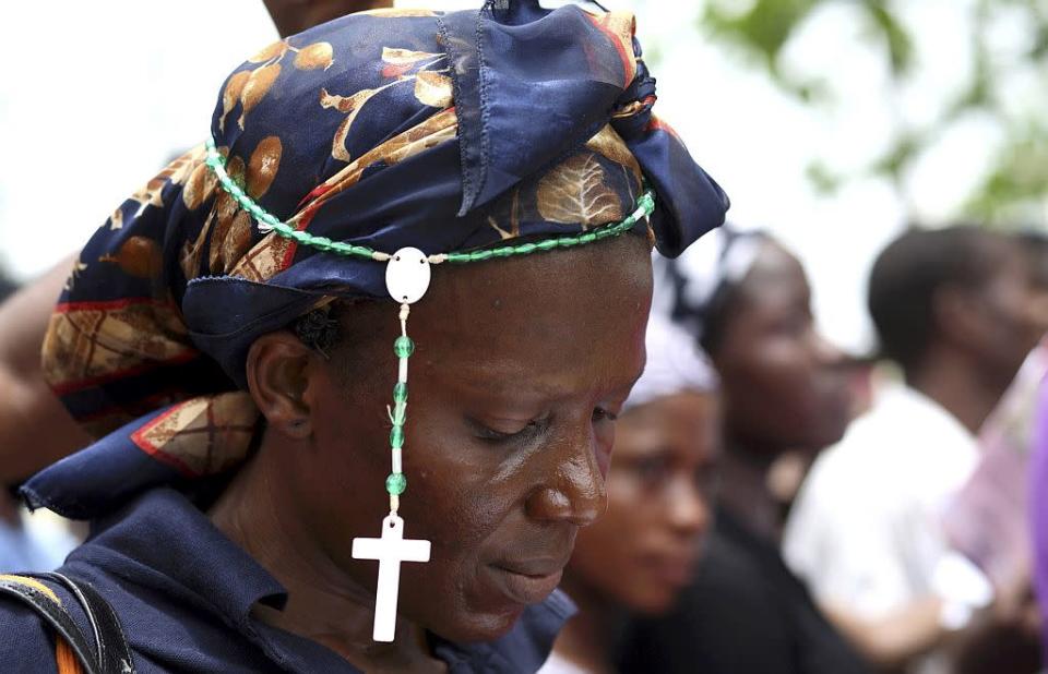 �A Christian woman wears a rosary at a procession during a ritual to mark the death of Jesus Christ on Good Friday in Nigeria's commercial capital Lagos, in this April 10, 2009 file picture.