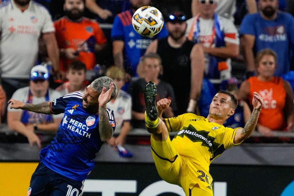 FC Cincinnati's Luciano Acosta protects himself from a kick during the FC Cincinnati vs. Columbus Crew match at TQL Stadium on Saturday September 14, 2024. The match ended with a 0 - 0 tie.