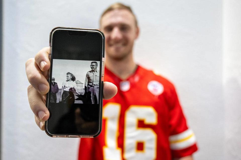 Philip Rineberg, a Kansas City Chiefs fan, showcases a photo of his grandfather on Monday, Feb. 5, 2024, in Guymon, Okla. Rineberg reminisced about his earliest memories of the Chiefs, recalling his grandfather proudly wearing a Chiefs hat.