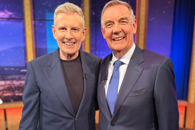 Patrick Kielty with Bryan Dobson on Friday night in suits and smiling