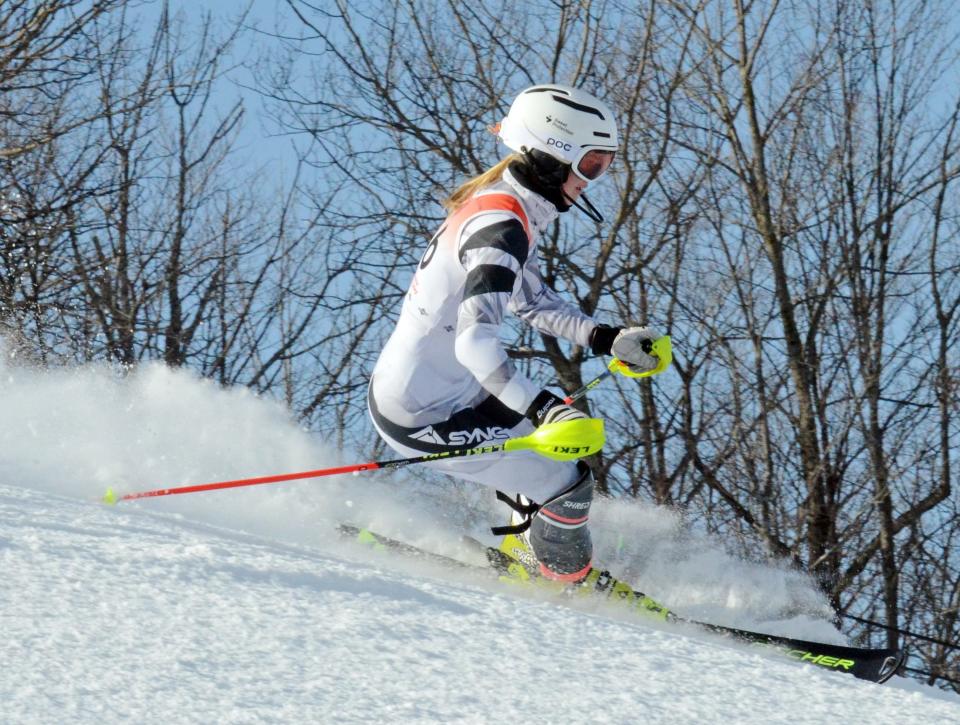Petoskey's Marley Spence topped the competition in both slalom and giant slalom for a second straight year, while earning her fourth and fifth state titles as an individual.