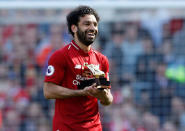 Soccer Football - Premier League - Liverpool vs Brighton & Hove Albion - Anfield, Liverpool, Britain - May 13, 2018 Liverpool's Mohamed Salah celebrates with the Golden Boot after the match Action Images via Reuters/Carl Recine