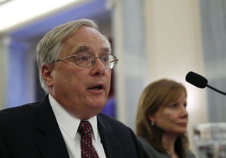 General Motors general counsel Michael Millikin and Chief Executive Mary Barra (R) appear before the Senate Commerce, Science and Transportation Subcommittee in Washington July 17, 2014. REUTERS/Gary Cameron