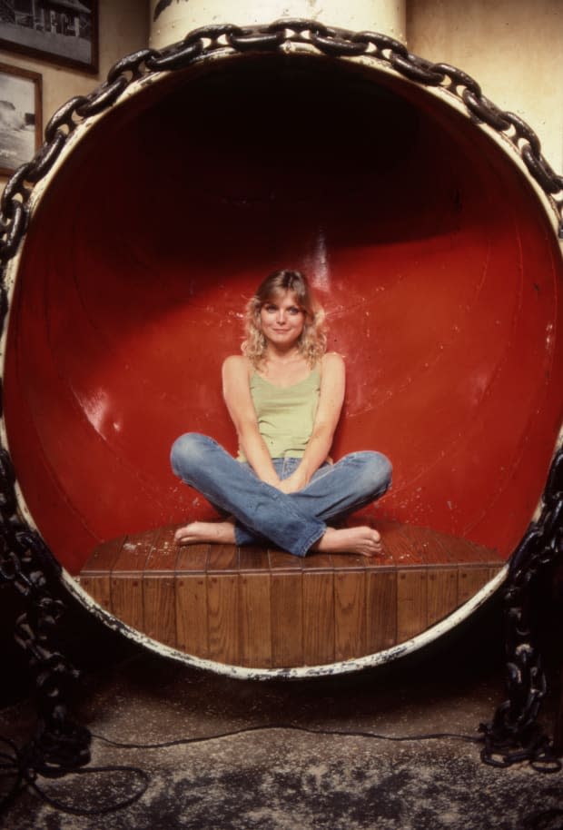 Michelle Pfeiffer lays in a ship's air vent at a restaurant called Gladstone's overlooking the Pacific Ocean. Her 1982 film "Grease 2" was about to be released. July 5, 1982, laying in a funnel, Pacific Palisades, California.<p><a href="https://www.gettyimages.com/detail/869779522" rel="nofollow noopener" target="_blank" data-ylk="slk:Paul Harris/Getty Images;elm:context_link;itc:0;sec:content-canvas" class="link ">Paul Harris/Getty Images</a></p>