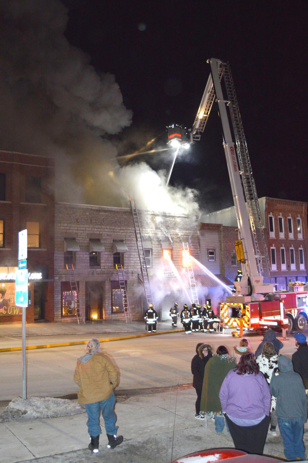 Firefighters on Jan. 13, 2022, battle a blaze in Waukon that destroyed two businesses and endangered a family living in an upstairs apartment. The owner of one of the businesses, Mindy Jo Jones, is charged with arson.