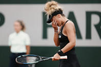 France's Leolia Jeanjean reacts after missing a shot against Romania's Irina-Camelia Begu during their third round match at the French Open tennis tournament in Roland Garros stadium in Paris, France, Saturday, May 28, 2022. (AP Photo/Thibault Camus)