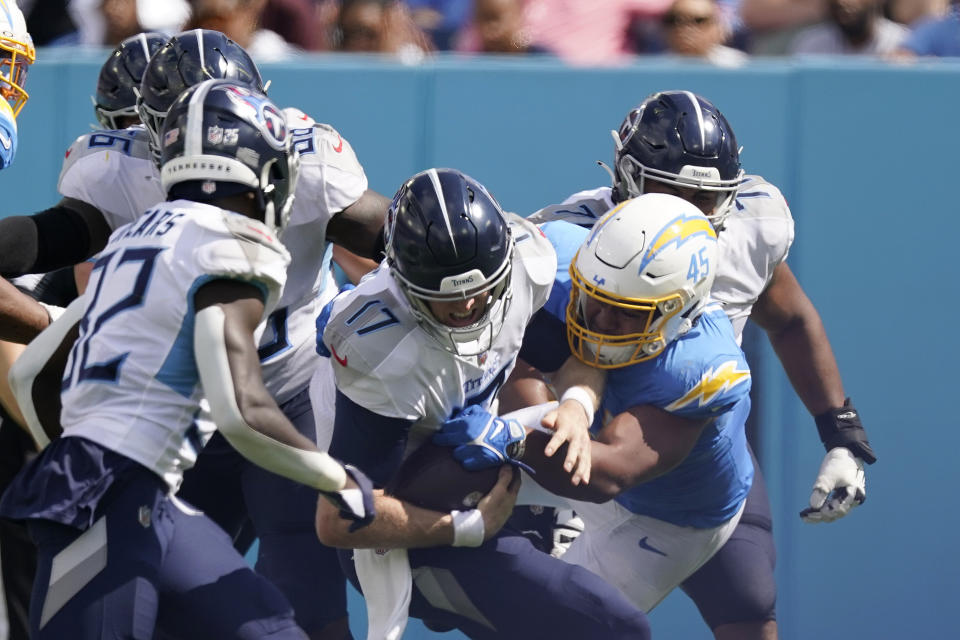 Tennessee Titans quarterback Ryan Tannehill (17) is sacked by Los Angeles Chargers linebacker Tuli Tuipulotu (45) during the second half of an NFL football game Sunday, Sept. 17, 2023, in Nashville, Tenn. (AP Photo/George Walker IV)