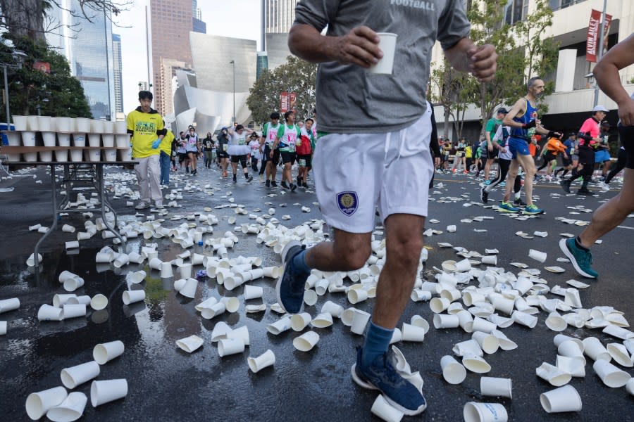 LOS ANGELES, CA MARCH 17: Discarded water cups line Grand Avenue in downtown during the LA Marathon on Sunday, March 17, 2024. (Myung J. Chun / Los Angeles Times via Getty Images)