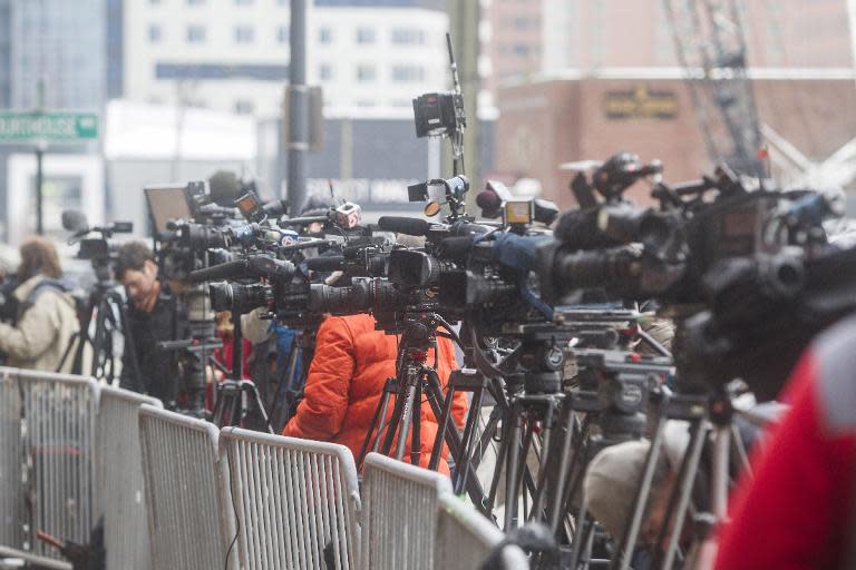 Journalists from around the world gathered outside the entrance to the John Joseph Moakley United States Courthouse in Boston, Massachusetts, on March 4, 2015